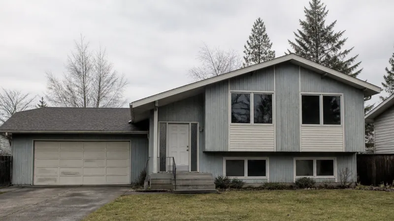 Suburban bungalow before renovation showing dated exterior