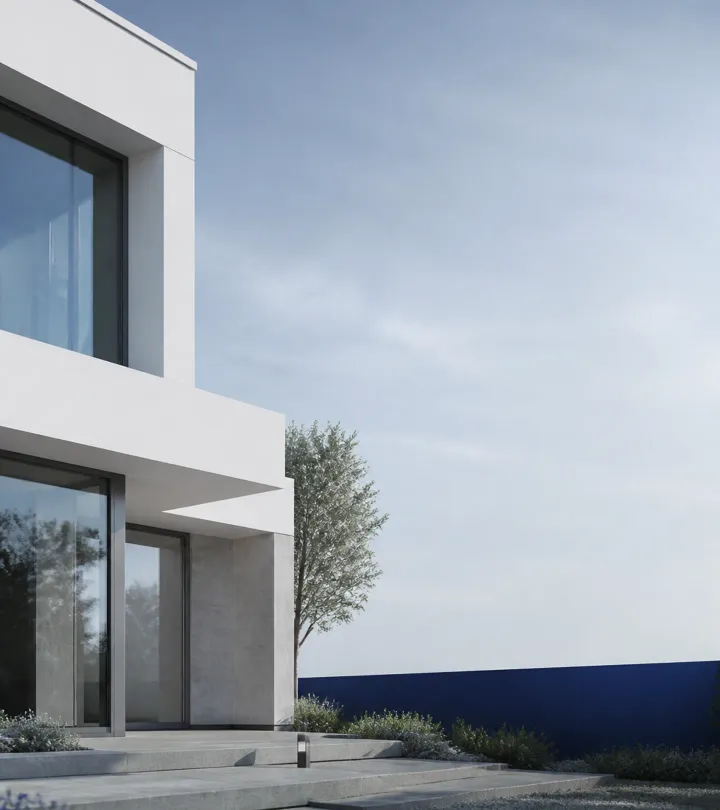 Modern minimalist residential architecture with clean geometric facade and large glass windows